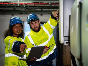 Two technicians discussing a start-up/commission project