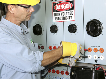 Technician working on an electrical panel